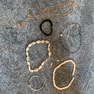 Bunch of necklaces and one pura vida bracelet